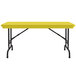 A yellow rectangular Correll folding table with black pedestal legs.