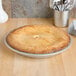 A pie in a Vollrath anodized aluminum pie pan.