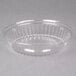 A Dart clear plastic dome lid with a ribbed rim over a clear plastic bowl.