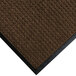 A dark brown WaterHog carpet mat with black rubber trim.