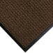 A dark brown WaterHog mat with black rubber trim.
