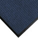 A navy blue WaterHog mat with a black rubber border.