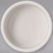 A Carlisle ivory bone melamine ramekin with a white rim on a white surface.