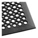 A close-up of a Choice black rubber anti-fatigue floor mat with beveled edges.