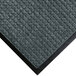A WaterHog bluestone carpet mat with a black rubber border.