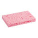 A Lavex pink cellulose sponge on a counter.