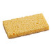 A white and yellow Lavex Eco Sisal Sponge with holes.