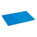 A blue Lavex scouring pad on a white counter.