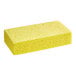 A large yellow Lavex cellulose sponge with holes.