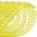 A close up of a yellow Lavex urinal screen.