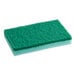 A green Lavex sponge pad on a white surface.