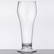 A customizable clear plastic footed pilsner glass on a table.