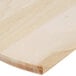 An American Metalcraft wood serving peel on a table.