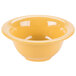 A close up of a GET Diamond Mardi Gras tropical yellow melamine bowl.