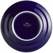 A close up of a Tuxton Concentrix cobalt blue plate with a white rim.