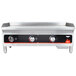 A stainless steel Vollrath countertop gas griddle with manual control knobs.