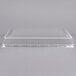 A clear plastic dome cover for a 1/2 sheet cake.