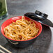 A close-up of a GET 12 oz. bowl of noodles with a lid.
