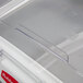 A clear plastic lid on a white Rubbermaid ingredient bin.