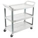 A Rubbermaid white three shelf utility cart with wheels.