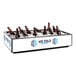A black IRP countertop cooler filled with ice and brown bottles of beer.