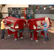 A group of women standing by a red Cambro Versa food and salad bar.