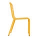 A yellow Grosfillex Cannes resin sidechair with white legs.