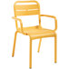 A stack of yellow Grosfillex outdoor armchairs with armrests.
