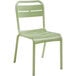 A sage green resin Grosfillex outdoor sidechair.