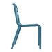 A blue Grosfillex resin sidechair with white legs.