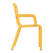 A yellow plastic Grosfillex Cannes outdoor armchair with white legs and armrests.