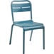 A blue plastic Grosfillex outdoor sidechair.