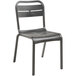 A black plastic Grosfillex outdoor sidechair with a back.