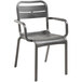 A gray Grosfillex resin outdoor armchair with a metal frame.