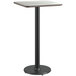 A white and black Lancaster Table & Seating bar height table with a black base.