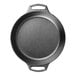A close-up of a Lodge black cast iron baking skillet with two handles.