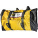 A yellow and black duffel bag with a black strap that says "Quick Dam Water-Gate"