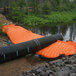 A large orange and black tube on the ground.