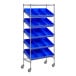 A metal shelving unit with blue bins on wheels.