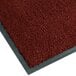 A crimson Notrax entrance floor mat with a grey border.