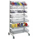 A Quantum chrome metal rack with hanging baskets on it.