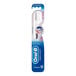 An Oral-B Sensi-Soft toothbrush in blue and white packaging.