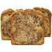 A close up of a loaf of Sweet Sam's Cinnamon Walnut Pound Cake with three slices cut from it.