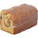 A loaf of Sweet Sam's Cinnamon Walnut Pound Cake wrapped in plastic.