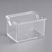 A clear plastic square sugar caddy.