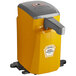 A yellow and grey Heinz countertop pump dispenser.