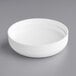 A white continuous thread dome lid with a circular object in the middle.