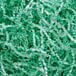 A pile of Spring-Fill Mint Green Radiance Crinkle Cut paper shred.