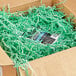 A box with Spring-Fill Mint Green Crinkle Cut Paper Shred inside.
