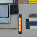 A black rectangular Ideal Warehouse loading dock light with holes.